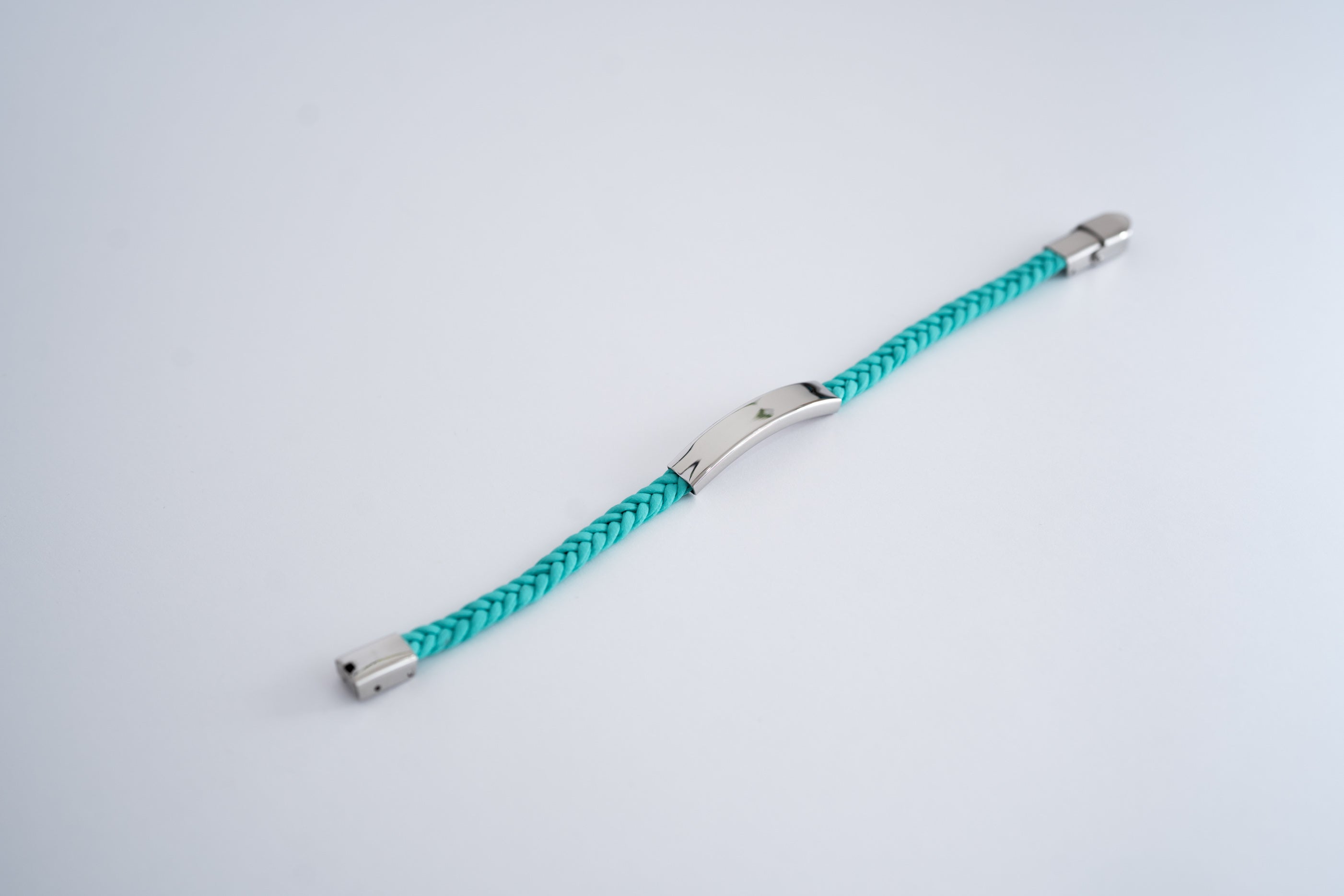 Braided bracelet with multicolor steel plate