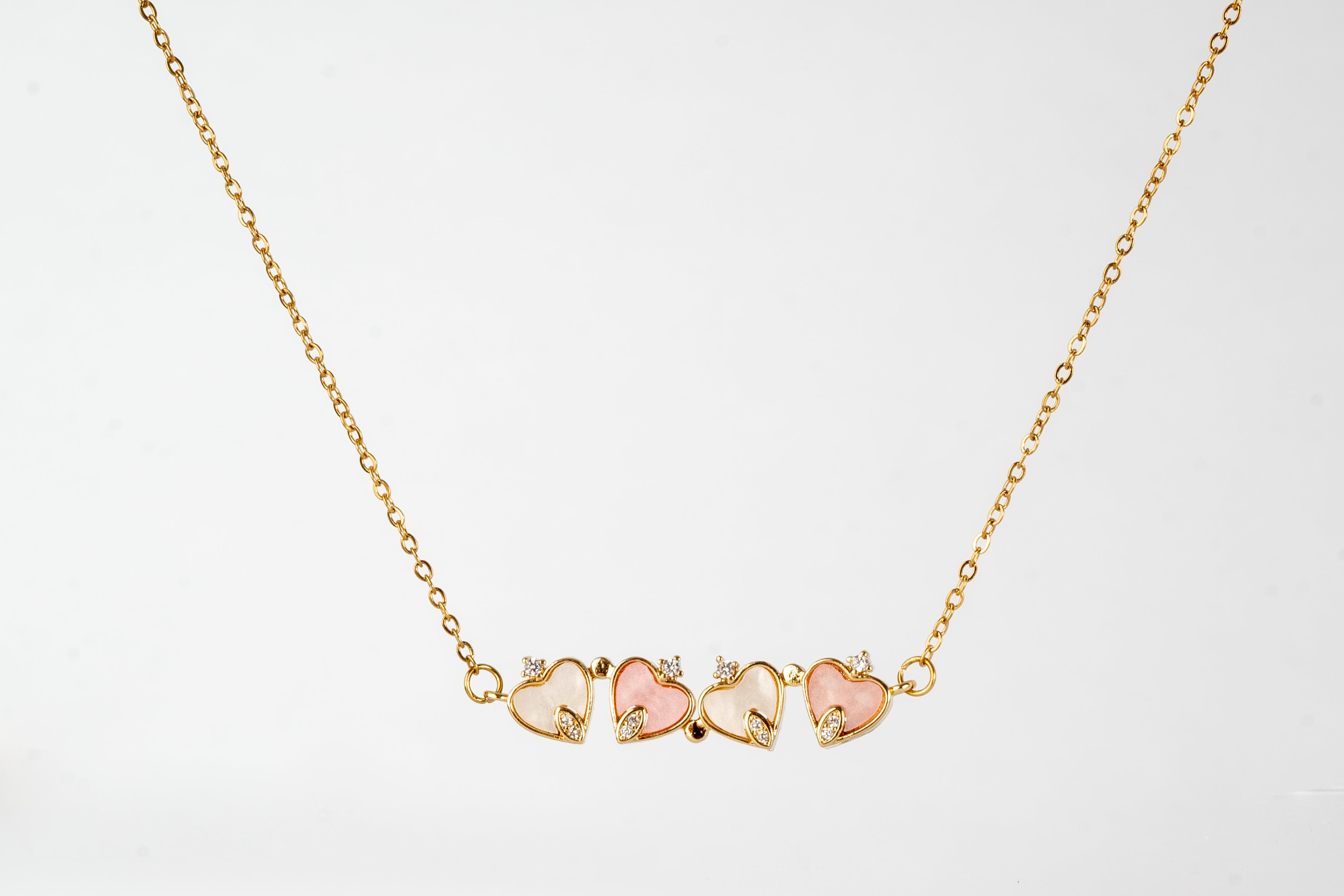 Necklace with small heart-shaped charm that can be transformed into a four-leaf clover - symbol of love and luck 